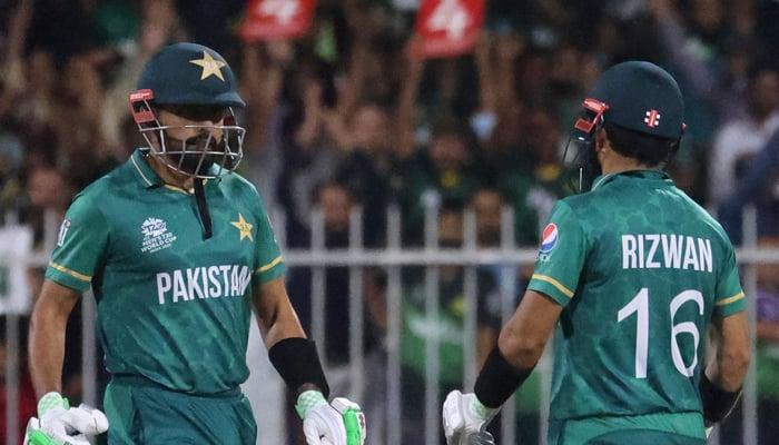 Pakistans captain Babar Azam (L) and Mohammad Rizwan talk during the ICC Twenty20 World Cup cricket match between Pakistan and New Zealand at the Sharjah Cricket Stadium in Sharjah on October 26, 2021. — AFP/File