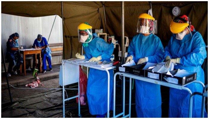 Health workers at the screening and testing tents set up at the Charlotte Maxeke Hospital in Johannesburg, South Africa. PHOTO: AFP