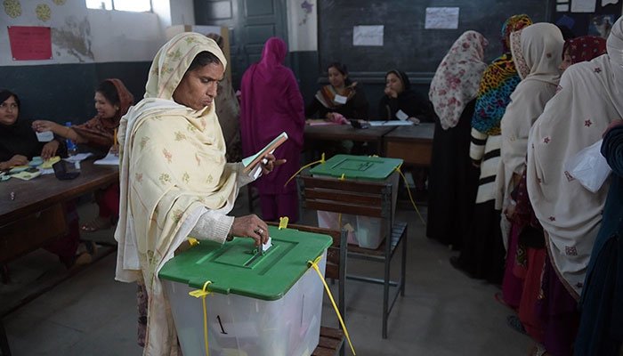 A woman casts a vote at a polling station. Photo: Geo.tv/file