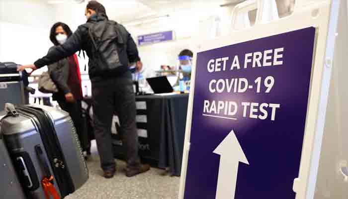 People who arrived on international flights wait to be tested on the first day of a new rapid COVID-19 testing site for arriving international passengers at Los Angeles International Airport (LAX) on December 3, 2021 in Los Angeles, California.-AFP