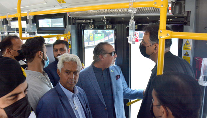 Asad Umar along with Imran Ismail visiting Green Line Bus Transit System in Karachi ahead of its inauguration tomorrow. — PID