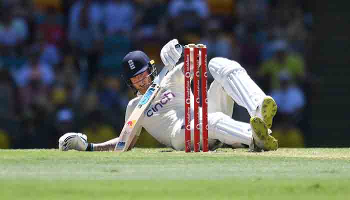 Ben Stokes of England falls while making runs during day four of the first Ashes cricket Test match between England and Australia at the Gabba in Brisbane on December 11, 2021. -AFP