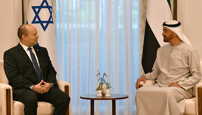 A handout picture released by the Israeli Government Press Office (GPO) shows Abu Dhabi´s Crown Prince Sheikh Mohammed bin Zayed Al-Nahyan (R) meeting with Israeli Prime Minister Naftali Bennett following his arrival in the Emirati capital, on December 12, 2021. — AFP