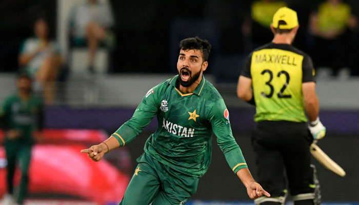 Pakistans Shadab Khan celebrates after taking the wicket of Australias David Warner (not pictured) during the ICC mens Twenty20 World Cup semi-final match between Australia and Pakistan at the Dubai International Cricket Stadium in Dubai on November 11, 2021. — Qureshi/AFP