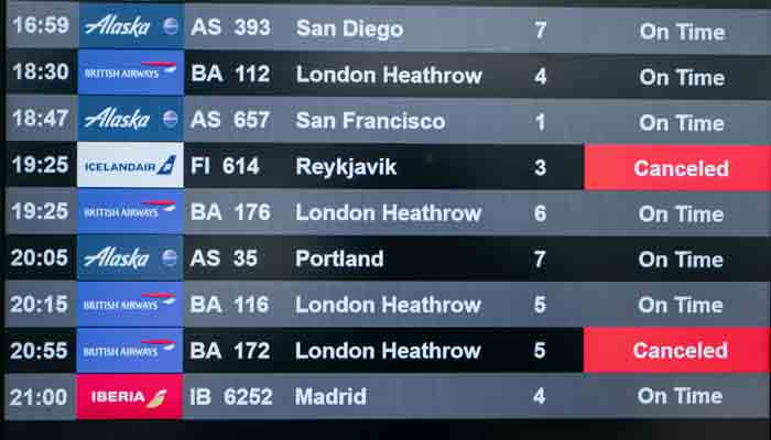 An information screen lists multiple cancelled flights at Terminal 7 of John F. Kennedy International Airport on December 24, 2021 in New York City.-AFP