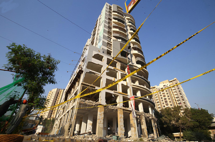 The 15-storey-high Nasla Tower in the process of being demolished. — INP