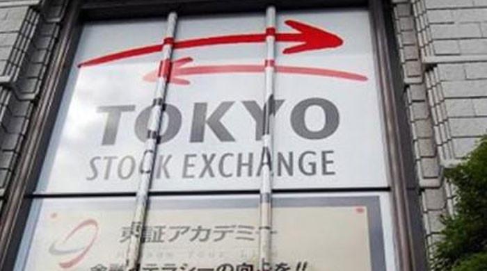 Tokyo stocks end down, but Nikkei up nearly 5% in 2021