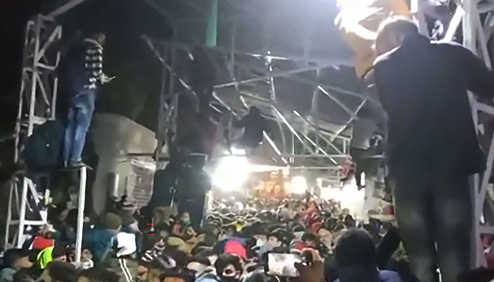 This frame grab from an NNIS video taken on January 1, 2022 shows a packed crowd of devotees at the Vaishno Devi shrine, one of the most revered Hindu sites, near Katra town in Indian occupied Jammu and Kashmir. — AFP