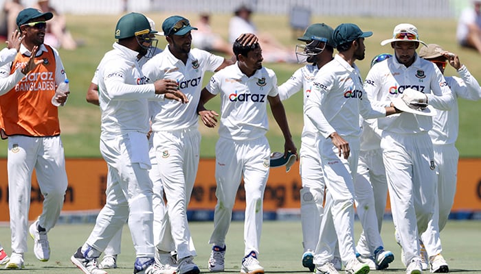 Bangladesh celebrate the final wicket of New Zealand´s Trent Boult during the fifth day of the first cricket Test match between New Zealand and Bangladesh at the Bay Oval in Mount Maunganui on January 5, 2022. — AFP