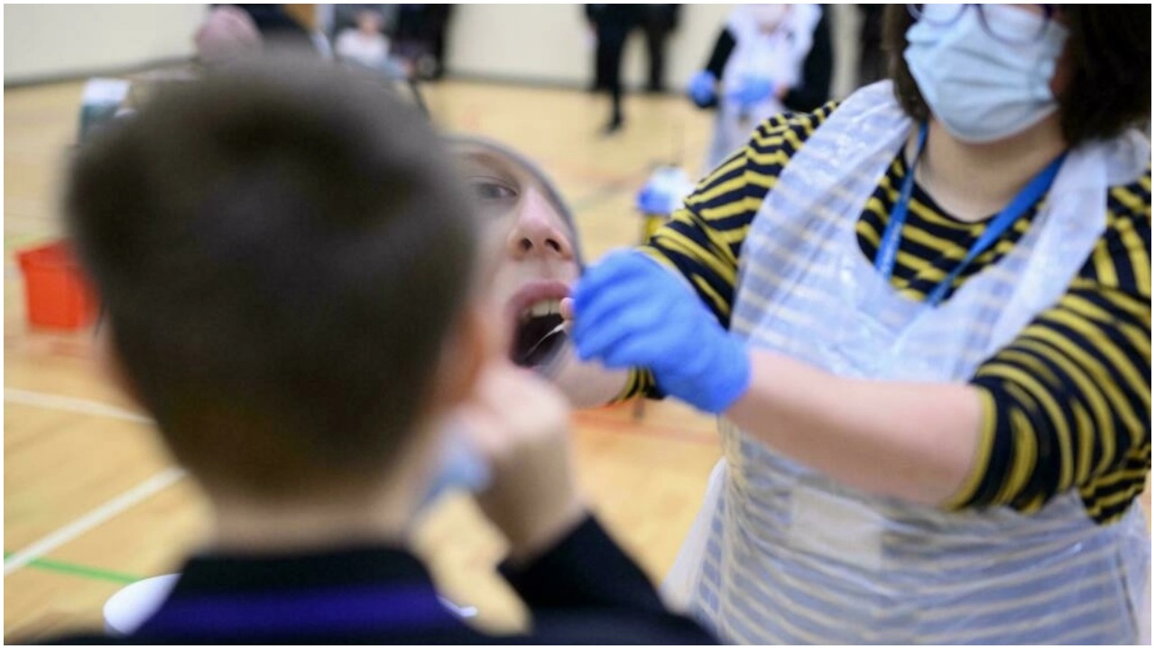 A health worker takes a mouth swab for coronavirus diagnostic test. — AFP