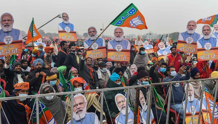 Bharatiya Janata Party supporters hold cutouts of Prime Minister Narendra Modi at a January 5 rally in Firozpur, India. — Narinder Nanu/AFP/Getty Images
