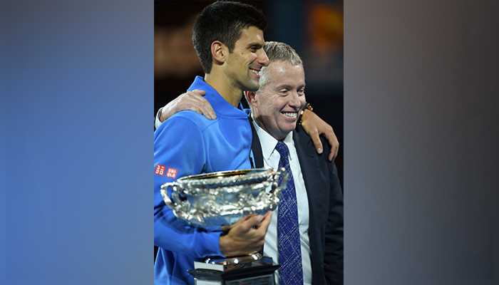 This file photo taken on February 1, 2015 shows Serbias Novak Djokovic (L) holding the Norman Brookes Trophy as he poses with tournament director Craig Tiley after his victory in the mens singles final against Britains Andy Murray on day 14 of the 2015 Australian Open tennis tournament in Melbourne. — AFP/File