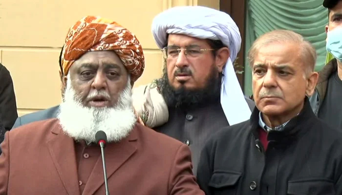 Pakistan Democratic Movement chief Maulana Fazlur Rehman (L) standing alongside Leader of the Opposition in the National Assembly Shahbaz Sharif, during a press conference, in Islamabad, on January 12, 2022 — Screengrab via Geo News.