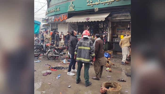 Rescue and police officials inspect the site of the blast near Lohari Gate area in Lahore on January 20, 2021. — Twitter