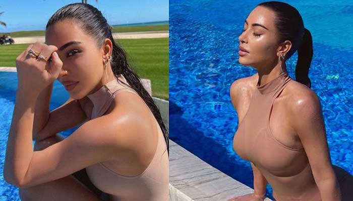 Kim Kardashian sends fans into frenzy as she flaunts gym-honed physique in new pool-side pics