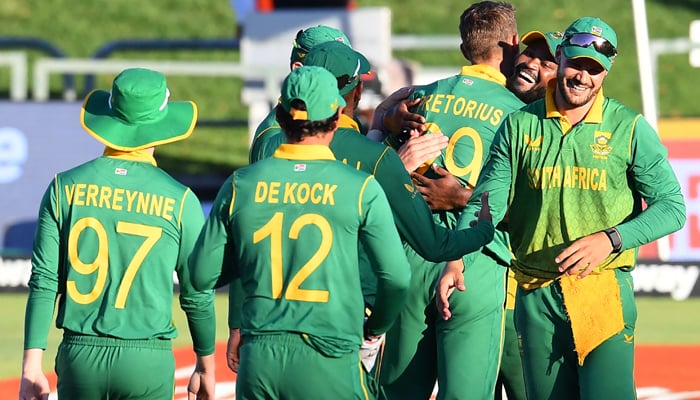 South Africas cricketers celebrate after victory in the third one-day international (ODI) cricket match between South Africa and India at Newlands Stadium in Cape Town on January 23, 2022. — Photo by Rodger Bosch/AFP