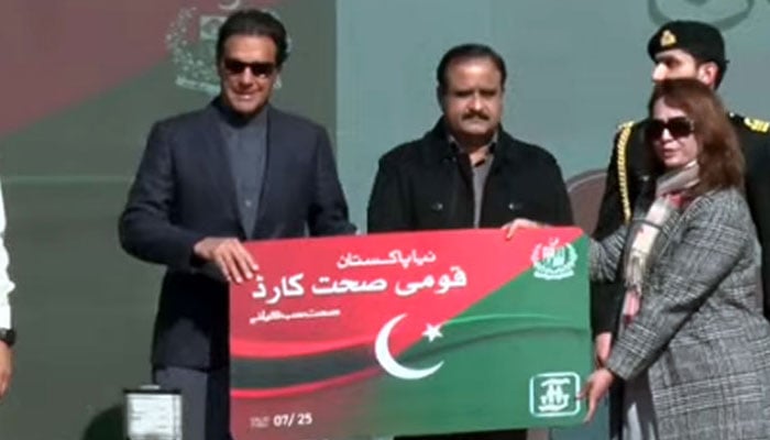 Prime Minister Imran Khan distributes Naya Pakistan Qaumi Sehat Card among citizens in Islamabad. Photo: Radio Pakistan