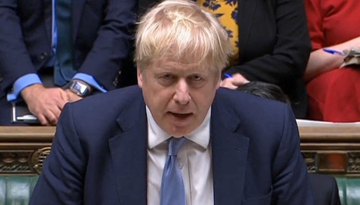 A video grab from footage broadcast by the UK Parliament´s Parliamentary Recording Unit (PRU) shows British Prime Minister Boris Johnson making a statement to MPs following the release of the Sue Gray report, in the House of Commons in London on January 31, 2022. — AFP
