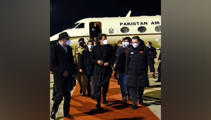Prime Minister Imran Khan speaking to Chinese officials after arriving in Beijing for his four-day visit, on February 3, 2022. — PID