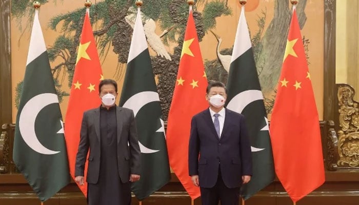 Prime Minister Imran Khan (L) meets Chinese President Xi Jinping (R) at the Great Hall of People in Beijing — PM Office