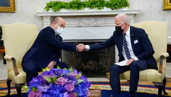 President Joe Biden shakes hands with Israeli Prime Minister Naftali Bennett in the Oval Office, August 27, 2021. -File photo