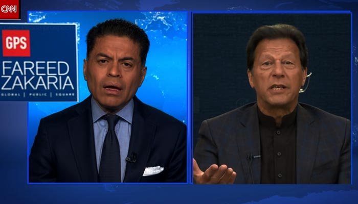 Prime Minister Imran Khan (right) speaks during an interview with CNNs Fareez Zakaria from Islamabad, on February 13, 2022. — RadioPakistan