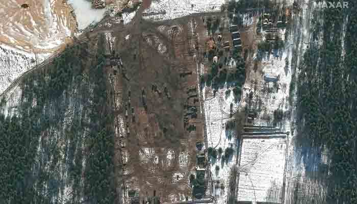 This Maxar satellite image taken and released on February 22, 2022 shows heavy equipment transporters on the western outskirts of Klintsy, Russia, approximately 40kms to the east of the border with Ukraine.-AFP