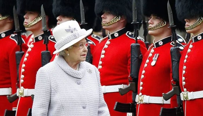 Queen receives flak for having royal guards wear hats made of bear fur