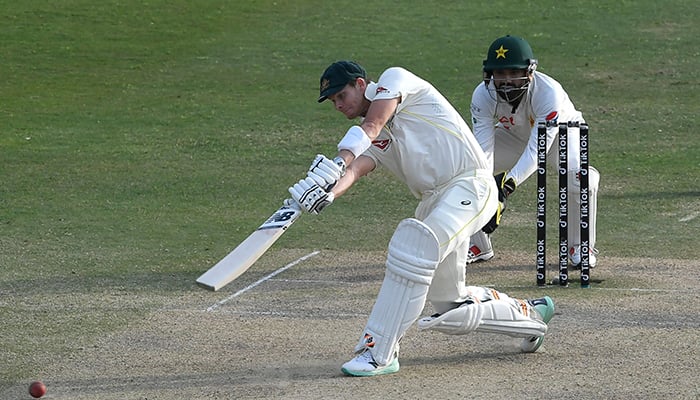 Australias Steven Smith plays a shot during the fourth day play of the first Test cricket match between Pakistan and Australia at the Rawalpindi Cricket Stadium in Rawalpindi on March 7, 2022. — AFP