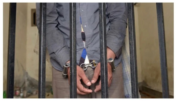 Representational image of a man behind bars — AFP