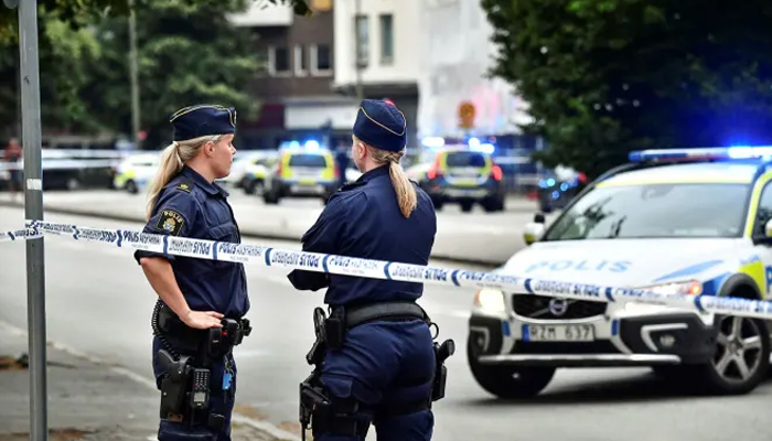 Police cordon off an area after four people were shot and injured in central Malmo, Sweden in this undated photo. — AFP/File