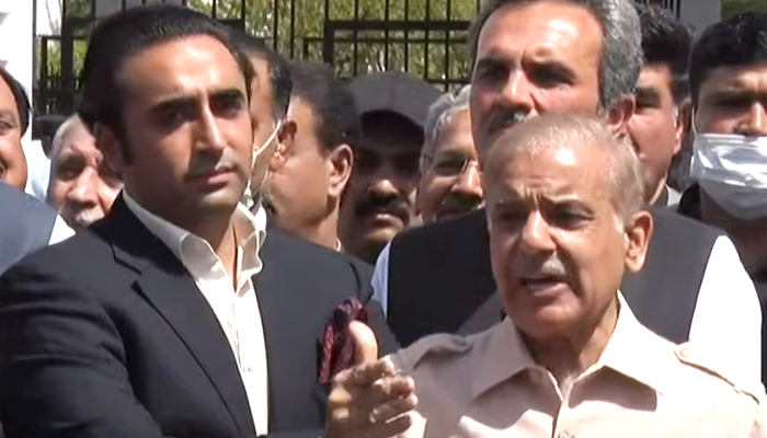 The leaders of the Oppositions two major parties — PPP Chairman Bilawal Bhutto-Zardari (left) and PML-N President Shahbaz Sharif (right) — speak to journalists outside the National Assembly in Islamabad, on March 25, 2022. — YouTube/HumNewsLive