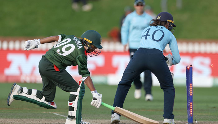 England´s wicketkeeper Amy Jones takes off the bails from the stumps to run out Bangladesh´s Fahima Khatun during the Women´s Cricket World Cup match between the England and Bangladesh at the Basin Reserve in Wellington. Photo: AFP