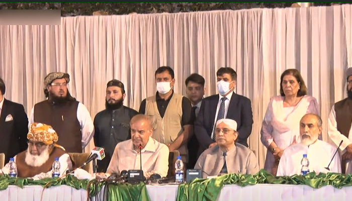 PML-N President Shahbaz Sharif (centre left) address a press conference alongside PDM chief Maulana Fazlur Rehman (left), PPP Co-chairman Asif Ali Zardari (centre right), and BAP Parliamentary Leader Khalid Magsi (right) in Islamabad, on March 28, 2022. — YouTube/HumNewsLive