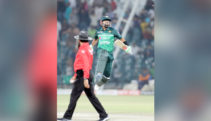 Pakistan skipper and flamboyant batter Babar Azam jumps in excitement during the second one-day international (ODI) cricket match between Pakistan and Australia at the Gaddafi Cricket Stadium in Lahore on March 31, 2022. — Twitter/@babarazam258