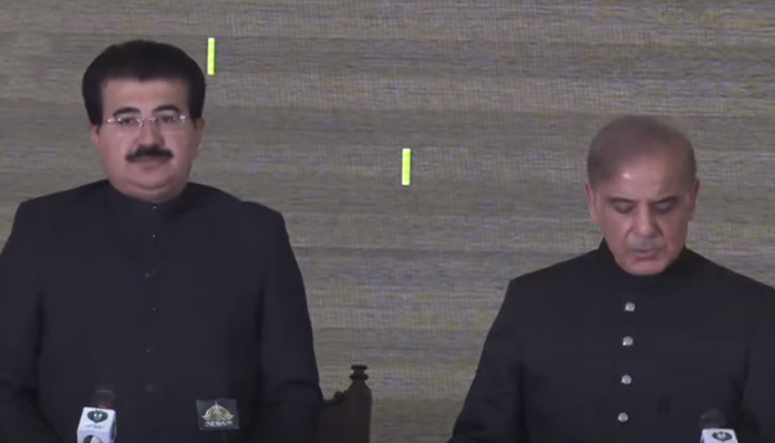 Senate Chairman Sadiq Sanjarani (left) administers the oath to Prime Minister Shehbaz Sharif. — Screengrab via PTV News