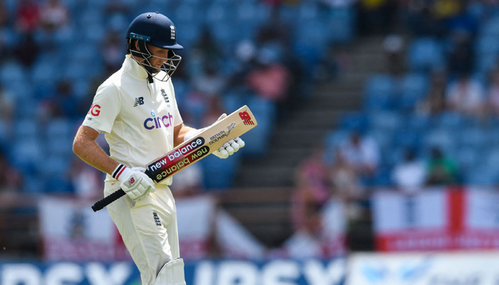 Joe Root of England walks off the field dismissed by Kyle Mayers of West Indies during the 3rd day of the 3rd and final Test between West Indies and England at Grenada National Cricket Stadium, Saint Georges, Grenada, on March 26, 2022. -AFP