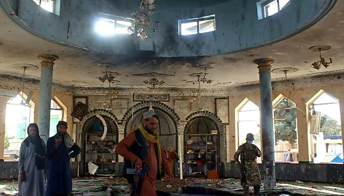 Taliban members investigate inside a mosque targeted in the suicide bomb attack in Kunduz, for which the Daesh group claimed responsibility. — AFP/File
