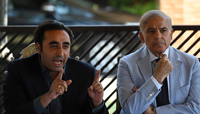 PPP Chairman Bilawal Bhutto Zardari (L) and Prime Minister Shehbaz Sharif (R) speak during a press conference in Islamabad on April 4, 2022. — AFP