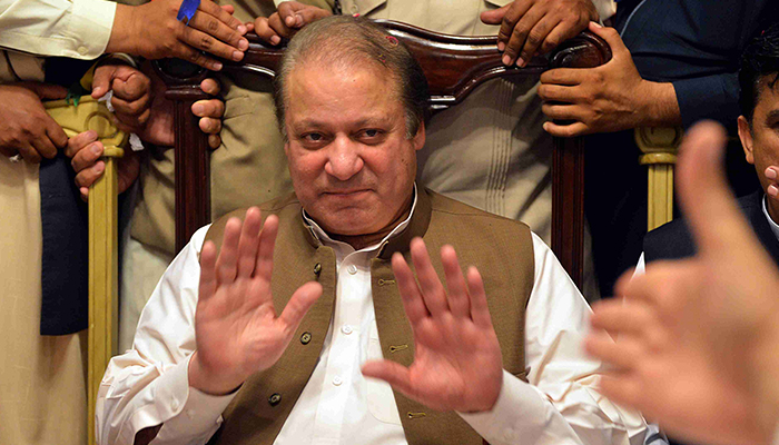 PML-N supremo and ex-prime minister Nawaz Sharif gestures as he attends a meeting of traders during his election campaign in Islamabad, on May 1, 2013. — AFP