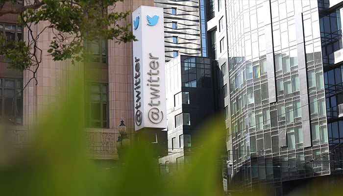 A sign is posted on the exterior of Twitter headquarters on April 27, 2022, in San Francisco, California. — AFP