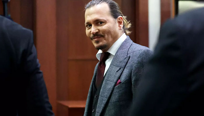 Johnny Depp laughs as bodyguard tells court about actors genitals