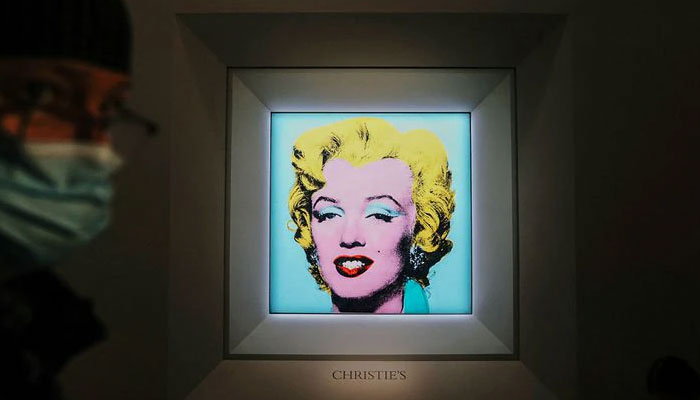 Andy Warhol’s famed ‘Marilyn’ silk-screen portrait fetches record $195 million at auction