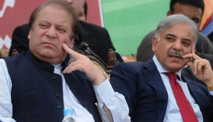 PML-N supremo and ex-prime minister Nawaz Sharif (left) with Prime Minister Shehbaz Sharif. — AFP/File