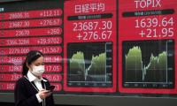 Tokyo shares close lower after US falls