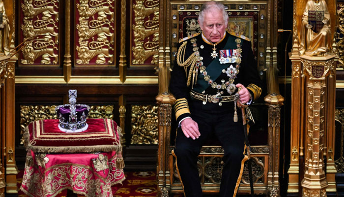 Prince Charles seated beside Queen’s crown for opening of parliament
