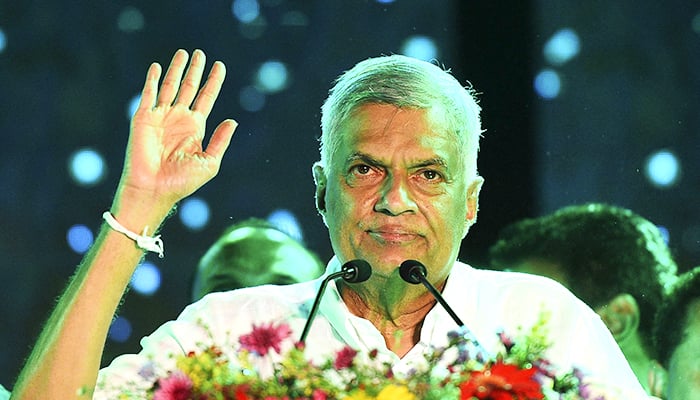 In this file photo taken on August 02, 2020, United National Party (UNP) party leader Ranil Wickremesinghe waves to supporters during the partys final campaign rally ahead of the upcoming parliamentary elections in Colombo. — AFP
