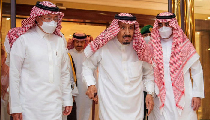 This handout photo provided by the official Saudi Press Agency on May 16, 2022, shows Saudi King Salman bin Abdulaziz (C) leaving a hospital in Jeddah. -AFP