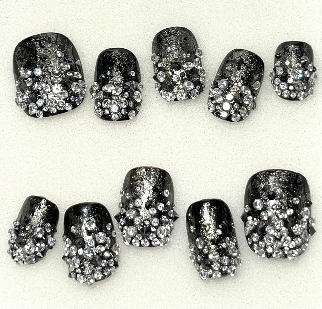 A close-up look at MGK’s diamond-studded nail set