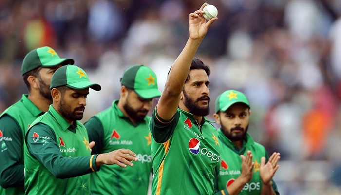 Pakistani pacer Hassan Ali and other players celebrate after taking a wicket in this file photo.